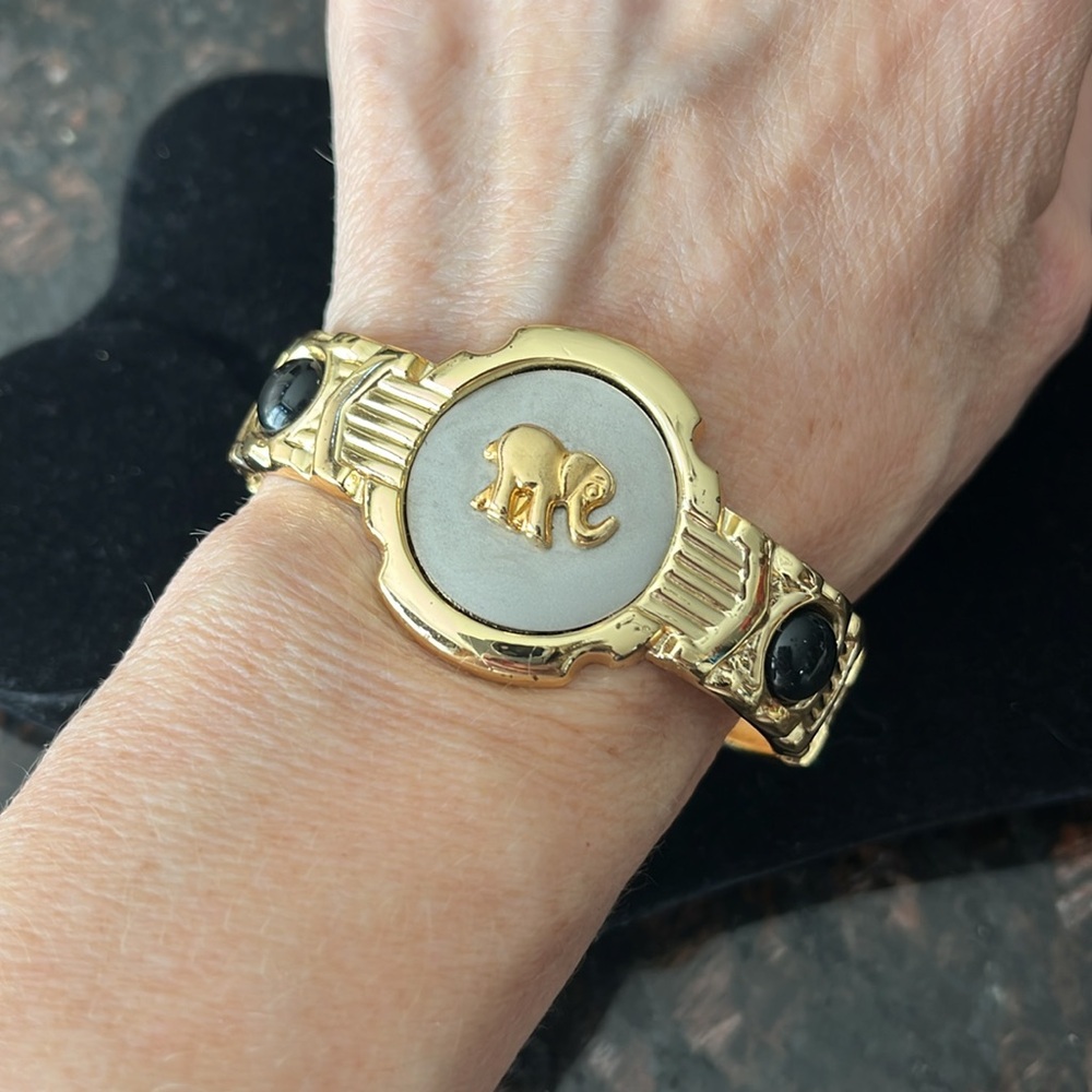 Gold Tone Round Disc Elephant Bracelet with Black Accents And Intricate Detail